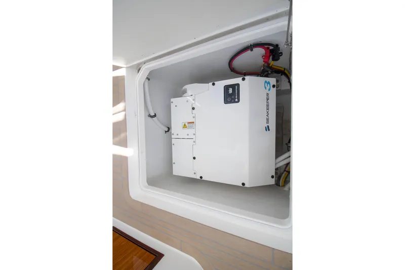 Slide: The Image of Control panel of 2025 MJM 38 X boat with switches and key fobs. - 45