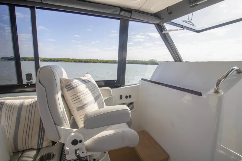 Slide: The Image of Luxury seating area on 2025 MJM 38 X boat, with scenic water view. - 47
