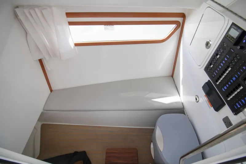 Slide: The Image of Interior cabin of 2025 MJM 38 X boat with seating and control panel. - 57