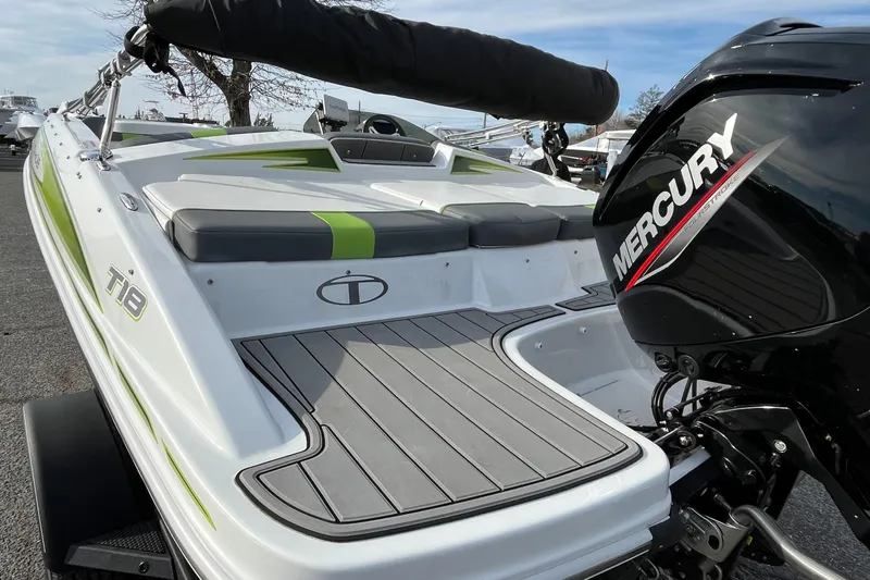 Slide: The Image of 2023 Tahoe T18 boat with Mercury engine, featuring sleek design and modern seating. - 3