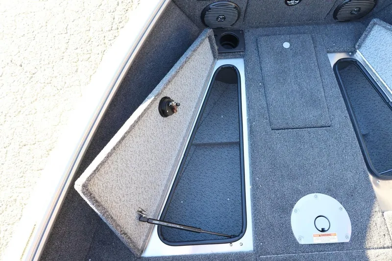 Slide: The Image of 2026 Lund 1775 Impact XS Sport boat interior with open storage compartments. - 21