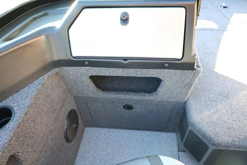 Slide: The Image of Interior of 2026 Lund 1775 Impact XS Sport boat, featuring storage compartments. - 31