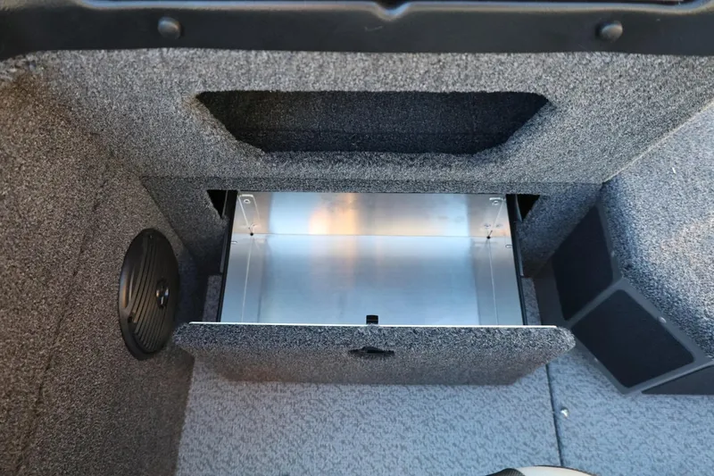 Slide: The Image of 2026 Lund 1775 Impact XS Sport boat storage compartment, open and empty. - 33