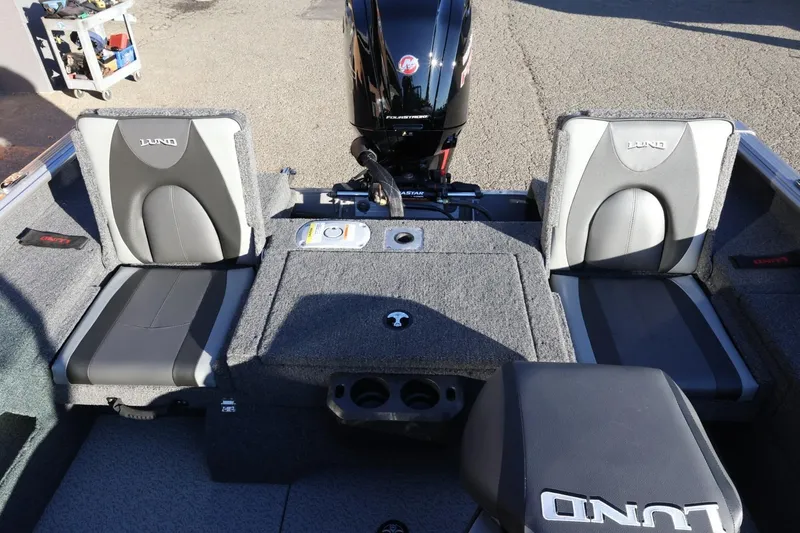 Slide: The Image of 2026 Lund 1775 Impact XS Sport boat interior with seating and motor. - 37