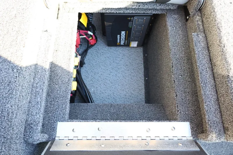 Slide: The Image of 2026 Lund 1775 Impact XS Sport boat battery compartment with precision charger. - 38