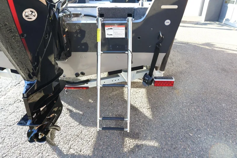 Slide: The Image of 2026 Lund 1775 Impact XS Sport boat with rear ladder and motor detail. - 42