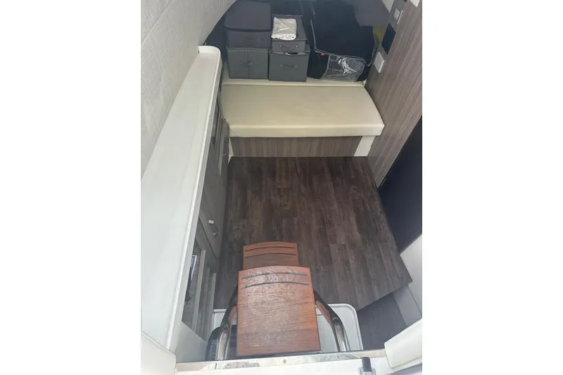 Slide: The Image of Interior of 2022 Regal 38 SAV boat with wooden flooring and seating area. - 13