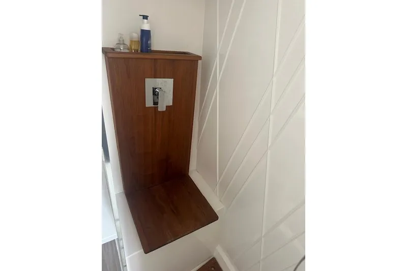 Slide: The Image of Wooden shower seat in 2022 Regal 38 SAV boat bathroom. - 17