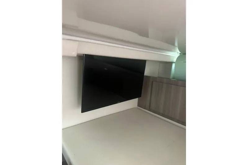 Slide: The Image of Interior of 2022 Regal 38 SAV yacht with mounted flat-screen TV. - 22