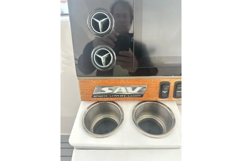 Slide: The Image of Dashboard of 2022 Regal 38 SAV with cup holders and controls. - 27