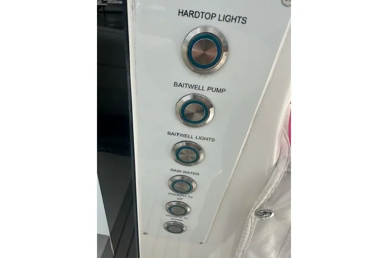 Slide: The Image of Control panel of a 2022 Regal 38 SAV boat with labeled buttons. - 30