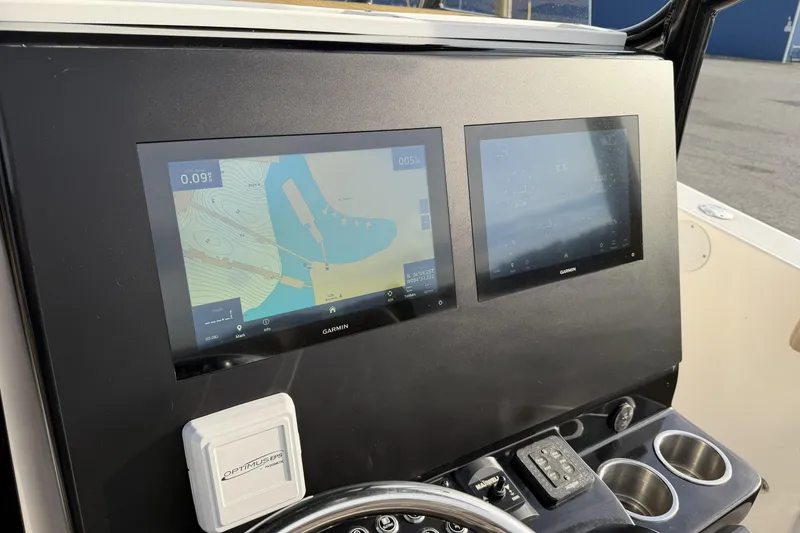 Slide: The Image of 2024 Sea Born SX239 Offshore boat dashboard with dual Garmin navigation screens. - 9