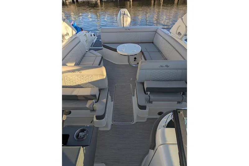 Slide: The Image of 2021 Sea Ray SDX 270 Outboard boat interior with luxurious seating and table. - 15