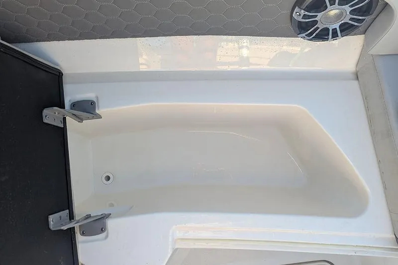 Slide: The Image of 2021 Sea Ray SDX 270 Outboard boat storage compartment with speaker detail. - 32