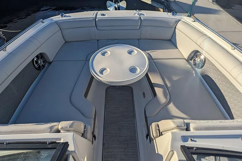 Slide: The Image of 2021 Sea Ray SDX 270 Outboard boat interior with spacious seating and round table. - 39