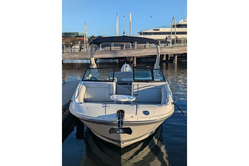 Slide: The Image of 2021 Sea Ray SDX 270 Outboard boat docked at marina, front view. - 5