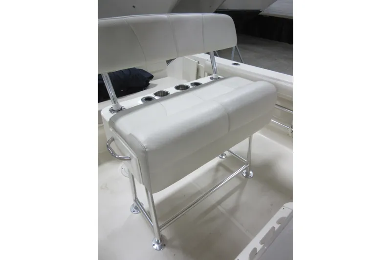 Slide: The Image of 2011 Pursuit C 230 Center Console boat seating with cup holders and stainless steel frame. - 18