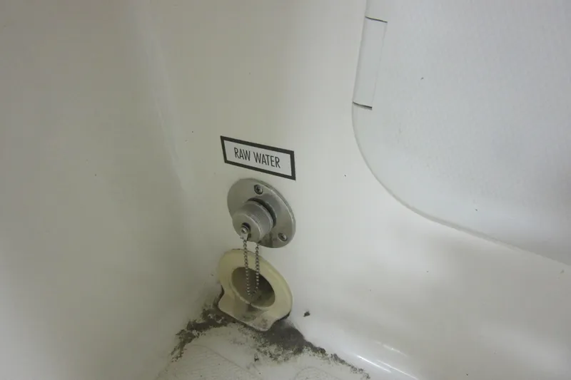 Slide: The Image of Raw water intake on 2011 Pursuit C 230 Center Console boat. - 21