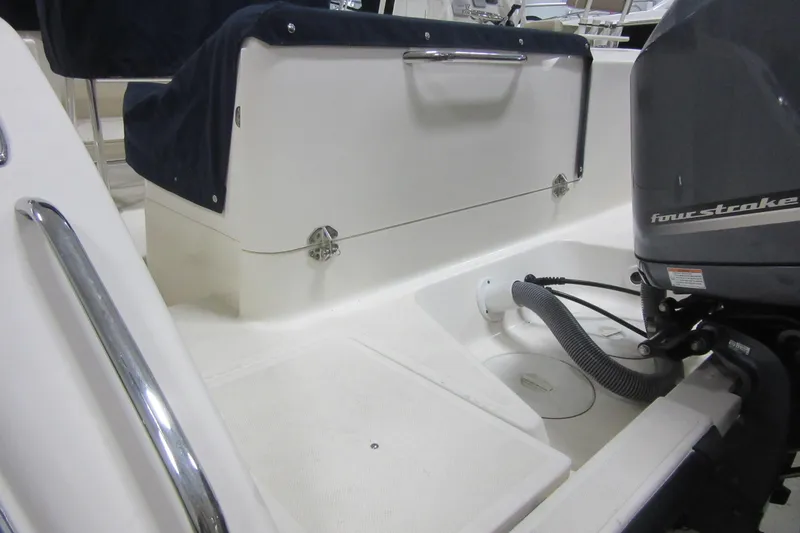 Slide: The Image of 2011 Pursuit C 230 Center Console boat with four-stroke engine detail. - 28