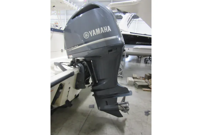 Slide: The Image of Yamaha outboard motor on 2011 Pursuit C 230 Center Console boat. - 29