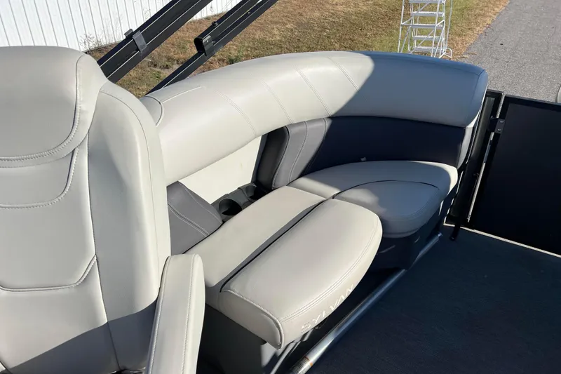 Slide: The Image of Luxurious seating on 2022 Sylvan Mirage X1 Tritoon boat, featuring sleek gray upholstery. - 25