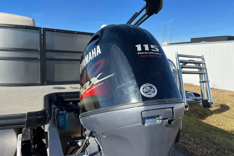 Slide: The Image of Yamaha 115 four-stroke engine on 2022 Sylvan Mirage X1 Tritoon boat. - 9