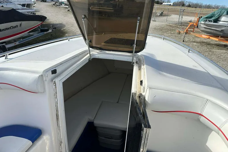 Slide: The Image of 1995 Wellcraft 302 Scarab Sport boat interior with open cabin hatch. - 10
