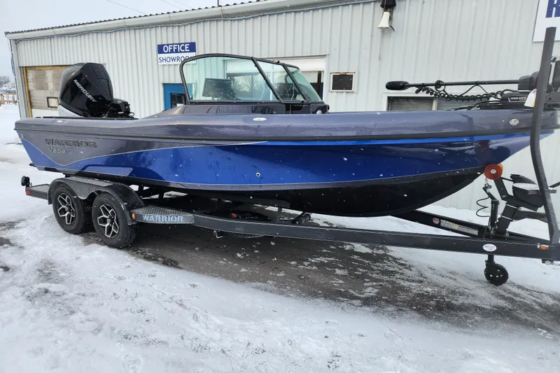 The Image of 2026 Warrior V208 boat on trailer, parked outside showroom in snowy conditions. - 1