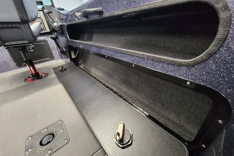 Slide: The Image of Interior of 2026 Warrior V208 boat showing storage compartment and seating area. - 15