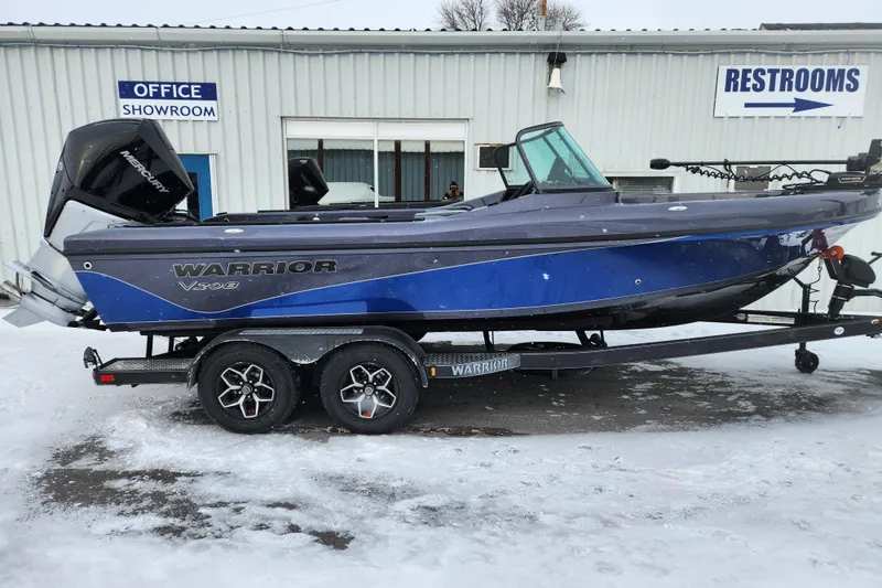Slide: The Image of 2026 Warrior V208 boat on trailer outside showroom in snowy setting. - 3
