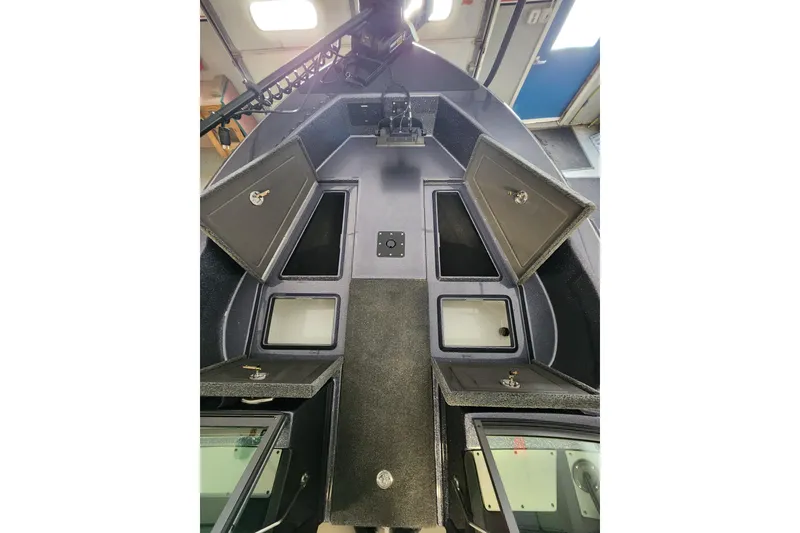 Slide: The Image of Interior view of 2026 Warrior V208 boat with open storage compartments. - 6