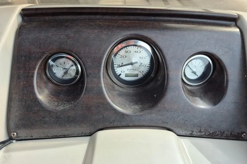 Slide: The Image of Dashboard of a 2015 Bennington 24SSRX boat with RPM and fuel gauges. - 16