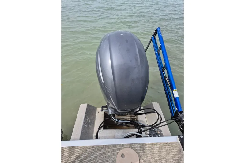 Slide: The Image of 2015 Bennington 24SSRX boat motor on water, rear view. - 26