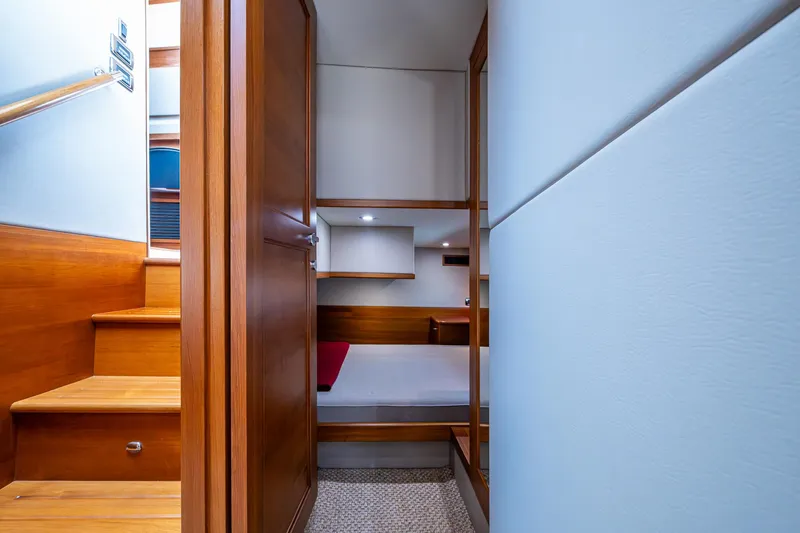 Slide: The Image of 2017 Grand Banks 44 Eastbay SX interior with wooden stairs and cozy cabin. - 36