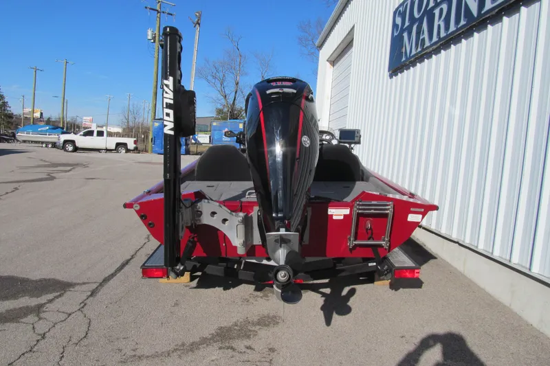 Slide: The Image of 2020 Tracker Pro Team 190 TX Tournament Edition boat, rear view, parked outside a marine store. - 3