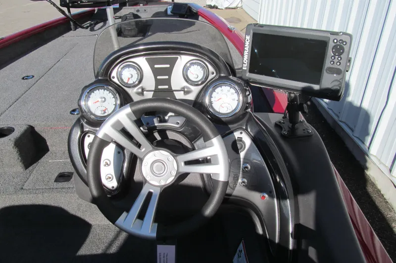 Slide: The Image of 2020 Tracker Pro Team 190 TX Tournament Edition boat dashboard with steering wheel and gauges. - 5