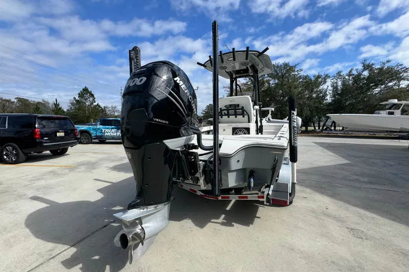 Slide: The Image of 2023 Pathfinder 2500 Hybrid boat with Mercury engine in parking lot. - 12