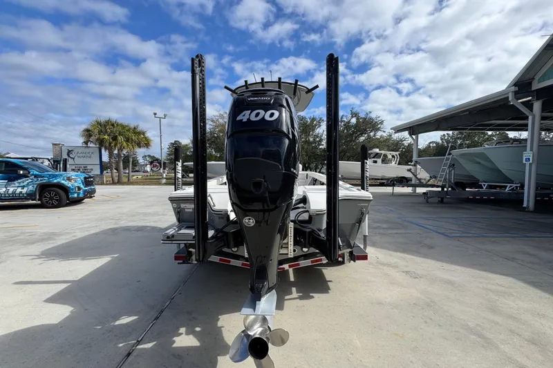 Slide: The Image of 2023 Pathfinder 2500 Hybrid boat with powerful 400 Verado engine in a marina setting. - 13