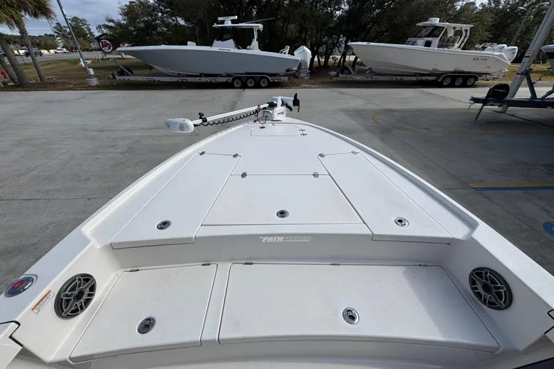 Slide: The Image of 2023 Pathfinder 2500 Hybrid boat deck with storage compartments and speakers. - 18