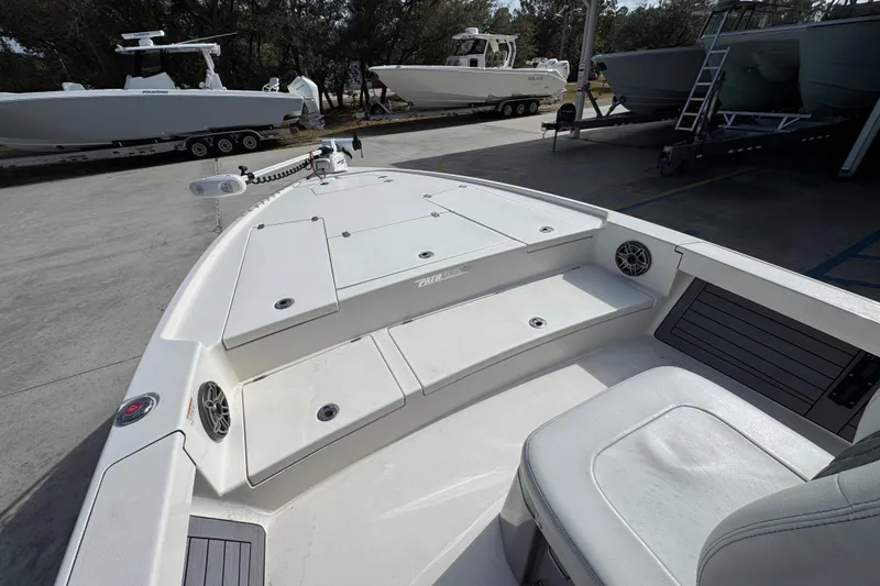 Slide: The Image of 2023 Pathfinder 2500 Hybrid boat interior with seating and storage compartments. - 24