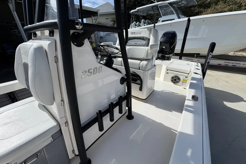 Slide: The Image of 2023 Pathfinder 2500 Hybrid boat interior with seating and steering console. - 25