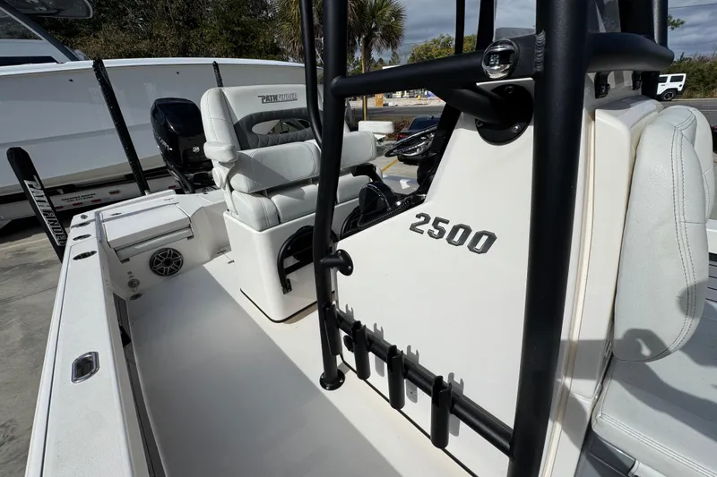 Slide: The Image of 2023 Pathfinder 2500 Hybrid boat interior with seating and console details. - 26