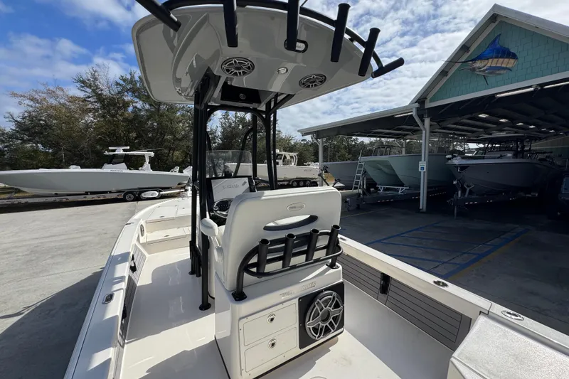 Slide: The Image of 2023 Pathfinder 2500 Hybrid boat docked, featuring a sleek design and modern amenities. - 35