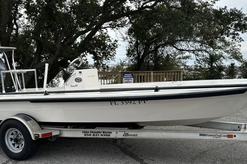 The Image of 2014 Maverick 17 HPX-V boat on trailer, parked near trees. - 0