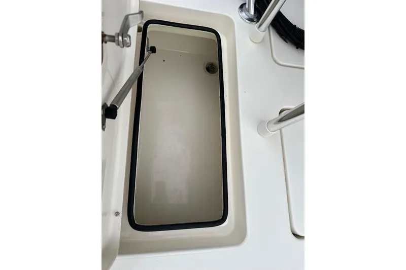 Slide: The Image of 2014 Maverick 17 HPX-V boat storage compartment, open and empty. - 12
