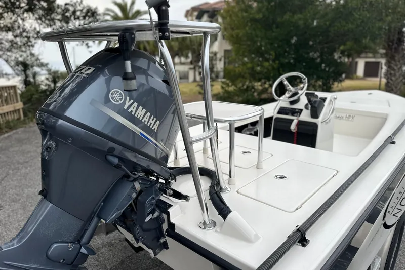 Slide: The Image of 2014 Maverick 17 HPX-V boat with Yamaha outboard motor, parked outdoors. - 3