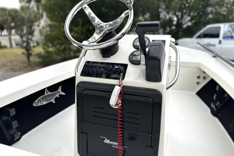 Slide: The Image of 2014 Maverick 17 HPX-V boat console with steering wheel and controls. - 7