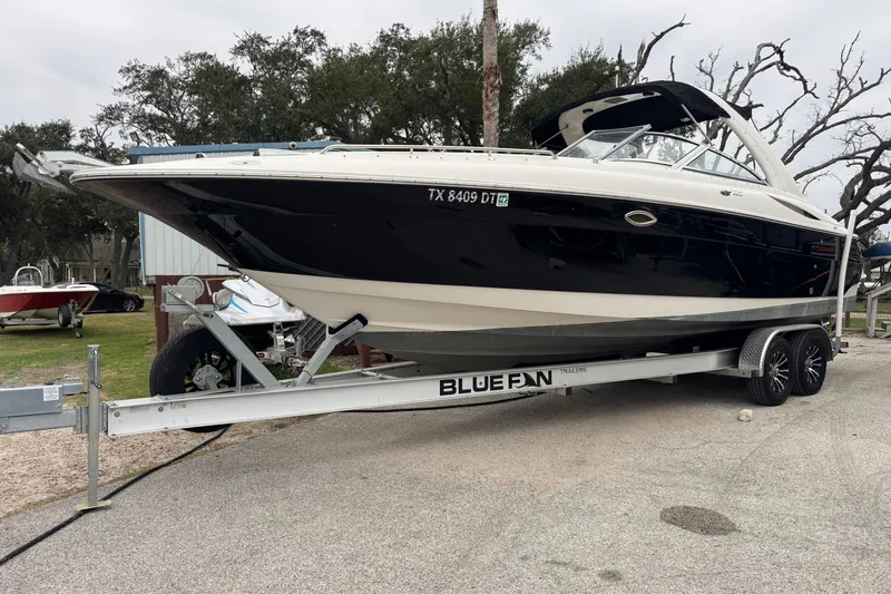 The Image of 2004 Monterey 298SS Super Sport boat on Blue Fin trailer, parked outdoors. - 0