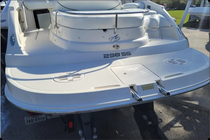 Slide: The Image of Rear view of a 2004 Monterey 298SS Super Sport boat, showcasing swim platform. - 12