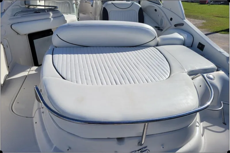 Slide: The Image of 2004 Monterey 298SS Super Sport boat interior with white cushioned seating. - 13